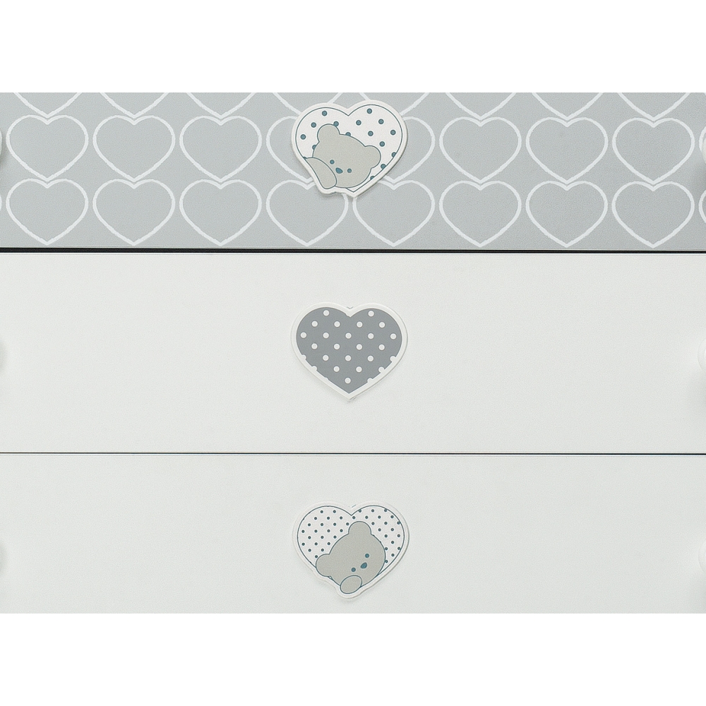 Spacious decorated drawers with hearts that hold a lovely bear